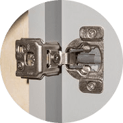 Close-up of a concealed soft-close cabinet hinge
